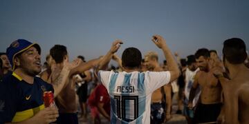 A man wears a jersey with the name of Argentina's soccer star Lionel Messi written on his back as the fans gather on Copacabana beach in Rio de Janeiro, Brazil, Monday, July 1, 2019\u002E Argentina will play against Brazil for the semifinals of the Copa America on July 2\u002E (AP Photo/Leo Correa)