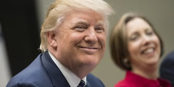 U.S. President Donald Trump smiles during a National Economic Council listening session with small and community bank executives in the Roosevelt Room of the White House in Washington, D.C., U.S., on Thursday, March 9, 2017. Trump assured a group of U.S.