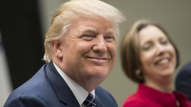 U.S. President Donald Trump smiles during a National Economic Council listening session with small and community bank executives in the Roosevelt Room of the White House in Washington, D.C., U.S., on Thursday, March 9, 2017. Trump assured a group of U.S.