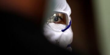 A health worker interacts with a man after collecting swab sample to test for COVID-19 at a government dispensary in Mumbai, India, Monday, Sept\u002E 14, 2020\u002E India's coronavirus cases are now the second-highest in the world and only behind the United States\u002E (AP Photo/Rajanish Kakade)