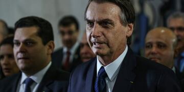 Jair Bolsonaro, Brazil's president, speaks to members of the media before delivering a pension reform proposal at the National Congress in Brasilia, Brazil, on Wednesday, Feb\u002E 20, 2019\u002E The plan holds out big rewards, including estimated savings of up to 1\u002E2 trillion reais ($320 billion) in 10 years, but its potentially tortuous progress will keep investors on edge for months\u002E Photographer: Andre Coelho/Bloomberg