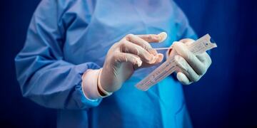 A health worker prepares to conduct a COVID-19 coronavirus molecular test in Parkview, Johannesburg, on October 22, 2020, provided free of charge by the City of Johannesburg Health Department\u002E (Photo by LUCA SOLA / AFP)