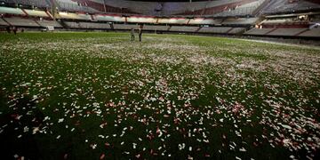 River campeu00f3n RecoparnPeople walk on the confetti-covered pitch of the Monumental stadium after River Plate won the Recopa Sudamericana final soccer match against Colombia's Independiente Santa Fe in Buenos Aires, Argentina, Friday, Aug. 26, 2016. (AP Pho
