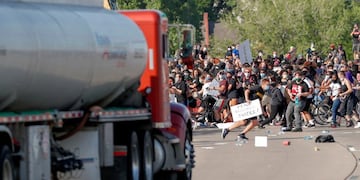 A tanker truck drives into thousands of protesters marching on 35W north bound highway during a protest against the death in Minneapolis police custody of George Floyd, in Minneapolis, Minnesota, U\u002ES\u002E May 31, 2020\u002E REUTERS/Eric Miller TPX IMAGES OF THE DAY