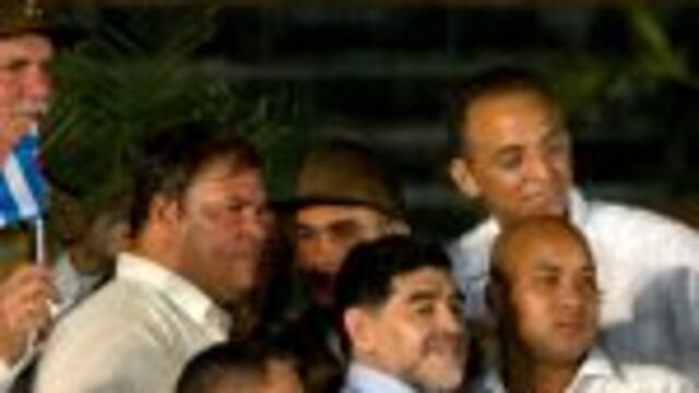 Argentina's soccer legend Diego Armando Maradona, center, stands on the stage after a rally honoring late Cuban leader Fidel Castro at Antonio Maceo plaza in Santiago, Cuba, Saturday, Dec. 3, 2016. After a four-day journey across the country through small