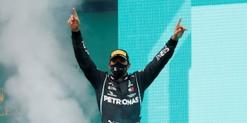 Mercedes driver Lewis Hamilton of Britain celebrates on the podium after winning the Turkish Formula One Grand Prix at the Istanbul Park circuit racetrack in Istanbul, Sunday, Nov\u002E 15, 2020\u002E (Murad Sezer/Pool via AP)