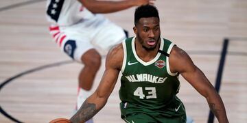 Milwaukee Bucks' Thanasis Antetokounmpo (43) dribbles the ball during the second half of an NBA basketball game, Tuesday, Aug\u002E 11, 2020, in Lake Buena Vista, Fla\u002E (AP Photo/Ashley Landis, Pool)