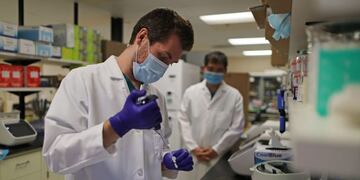 ROCKVILLE, MARYLAND - AUGUST 05: Lab Technician Carter Tavaglione prepares a solution that will be used to process coronavirus test samples at Advagenix, a molecular diagnostics laboratory, on August 05, 2020 in Rockville, Maryland\u002E An advanced genetics testing company, Advagenix has a contract with Montgomery County, Maryland, to test about 1 million people for COVID-19 over the next year\u002E The company is expanding by moving into additional lab space and doubling the size of its workforce to around 30 people to handle the increased work\u002E Chip Somodevilla/Getty Images/AFP\n== FOR NEWSPAPERS, INTERNET, TELCOS & TELEVISION USE ONLY ==