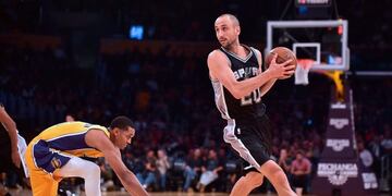 (FILES) This file photo taken on November 18, 2016 shows Manu Ginobili as he looks to pass getting away from Jordan Clarkson of the Los Angeles Lakers in Los Angeles, California during the NBA basketball matchup\u002E \nSan Antonio Spurs legend Manu Ginobili is poised to return for a 16th season with the NBA giants, reports said July 18, 2017\u002E The Argentine star, who turns 40 later this month, had hinted he may retire after the Spurs were downed in the Western Conference finals by Golden State last season\u002E\n / AFP PHOTO / Frederic J\u002E BROWN