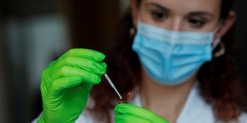 A biologist operates EasyCOV, a rapid salivary test for Covid-19 developed by French firm SkillCell, in Paris, France, October 12, 2020\u002E Picture taken October 12, 2020\u002E REUTERS/Benoit Tessier