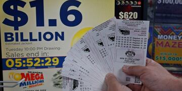 A customer, who did not want to be identified, displays the $200\u002E00 worth of Mega Millions tickets he bought at Downtown Plaza convenience store in Oklahoma City, Tuesday, Oct\u002E 23, 2018\u002E (AP Photo/Sue Ogrocki)