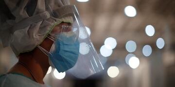 A social worker stands at Tecnopolis Park which has been repurposed as a shelter to quarantine COVID-19 patients who are asymptomatic or have light symptoms, in Buenos Aires, Argentina, Tuesday, Sept\u002E 1, 2020\u002E (AP Photo/Natacha Pisarenko)