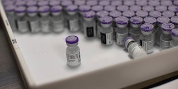 ID:4929327 FILE - In this Monday, Jan. 4, 2021 file photo, frozen vials of the Pfizer/BioNTech COVID-19 vaccine are taken out to thaw, at the MontLegia CHC hospital in Liege, Belgium. Envoys from World Trade Organization member nations are taking up a proposal to ease patents and other intellectual property protections for COVID-19 vaccines to help developing countries fight the pandemic, an idea backed by the Biden administration but opposed in other wealthy countries with strong pharmaceutical industries. On the table for a two-day meeting of a WTO panel opening Tuesday June 8, 2021, is a revised proposal presented by India and South Africa for a temporary IP waiver on coronavirus vaccines. (AP Photo/Francisco Seco, File)