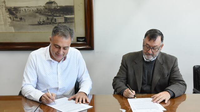 Luis Castellano y Silvio Fontanini firmando el convenio