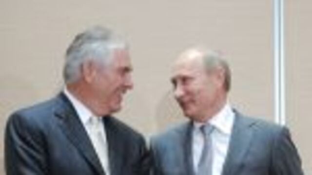 (FILES) This file photo taken on August 30, 2011 shows nRussia's Prime Minister Vladimir Putin (L) speaking with ExxonMobil President and Chief Executive Officer Rex Tillerson during the signing of a Rosneft-ExxonMobil strategic partnership agreement in Sochi on August 30, 2011. nPresident-elect Donald Trump on Tuesday tapped ExxonMobil chief Rex Tillerson, an oilman with deep ties to Russia, as his secretary of state.nTillerson's nomination comes just days after a secret CIA report accused Russia of interfering with the US election in favor of Trump, in a development which could complicate his confirmation. / AFP PHOTO / RIA NOVOSTI / ALEXEY DRUZHININ
