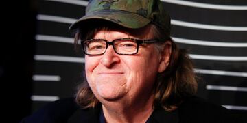 FILE - In this May 16, 2016 file photo, Michael Moore attends the 20th Annual Webby Awards at Cipriani Wall Street in New York. Moore premiered a surprise film about the U.S. presidential election on Tuesday, Oct. 18, 2016.