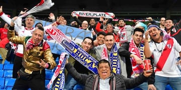 People take a selfie at a stand outside the Santiago Bernabeu stadium in Madrid, hours before the start of the second leg match of the all-Argentine Copa Libertadores final between River Plate and Boca Juniors, on December 9, 2018\u002E (Photo by BELEN DIAZ / AFP)