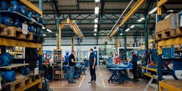 Alexandre Lacour, director general of Someflu SASA, center, speaks with employees on the factory floor at the company's industrial pump component assembly plant, in the Bagnolet district of Paris, France, on Wednesday, April 22, 2020\u002E French Junior Economy Minister Agnes Pannier-Runacher said in a recent interview that industry is operating at about half of its capacity, a lower level than in neighboring European countries\u002E Photographer: Cyril Marcilhacy/Bloomberg