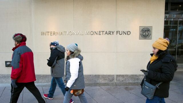 The International Monetary Fund (IMF) headquarters is seen Monday, Dec. 19, 2016, in Washington. The International Monetary Fund's managing director, Christine Lagarde, was convicted Monday of negligence by a special French court for her role in a contentious and generous arbitration award in 2008 to a politically connected tycoon.  The Washington-based IMF said after Monday's verdict that its executive board would meet soon