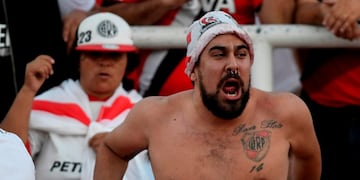 Fans of Argentine team River Plate cheer before the start of the Supercopa Argentina 2018 final football match against Boca Juniors at Malvinas Argentinas stadium in Mendoza, Argentina, on March 14, 2018\u002E / AFP PHOTO / Andres Larrovere