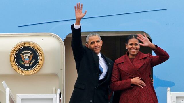 Former President Barack Obama and his wife Michelle wave to the crowd as they board an Air Force jet to depart Andrews Air Force base in Andrews Air Force Base, Md., Friday, Jan. 20, 2017. (AP Photo/Steve Helber)