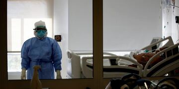 Dr\u002E Adriana Coronel stands inside the room of a COVID-19 patient at the Eurnekian Ezeiza Hospital on the outskirts of Buenos Aires, Argentina, Tuesday, July 14, 2020, during a government-ordered lockdown to curb the spread of the new coronavirus\u002E (AP Photo/Natacha Pisarenko)