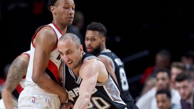 San Antonio Spurs guard Manu Ginobili, right, dribbles around Portland Trail Blazers guard Tim Quarterman during the first half of an NBA basketball game in Portland, Ore., Monday, April 10, 2017. (AP Photo/Craig Mitchelldyer)