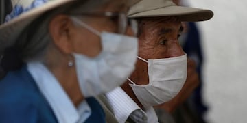 Elderly people wearing protective masks wait to receive an influenza vaccine at a clinic that specializes in respiratory illnesses, in Lima, Peru, Tuesday, March 17, 2020\u002E Peru's President Martin Vizcarra has declared a state of emergency, ordering citizens to stay in their homes and temporarily suspending certain constitutional rights, to contain the spread of coronavirus\u002E The vast majority of people recover from the new virus\u002E  (AP Photo/Martin Mejia)