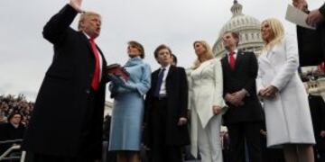 President Donald Trump takes the oath of office from Chief Justice John Roberts, as his wife Melania holds the bible, and with his children Barron, Ivanka, Eric and Tiffany, Friday, Jan. 27, 2017 on Capitol Hill in Washington. (Jim Bourg/Pool Photo via AP)