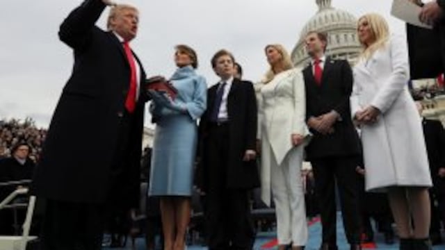 President Donald Trump takes the oath of office from Chief Justice John Roberts, as his wife Melania holds the bible, and with his children Barron, Ivanka, Eric and Tiffany, Friday, Jan. 27, 2017 on Capitol Hill in Washington. (Jim Bourg/Pool Photo via AP)