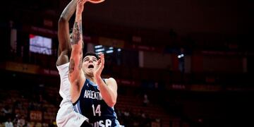 Chimezie Metu (L) of Nigeria defends against Gabriel Deck of Argentina during the Basketball World Cup Group B game between Nigeria and Argentina in Wuhan, Hubei province, on September 2, 2019\u002E (Photo by STR / AFP) / China OUT
