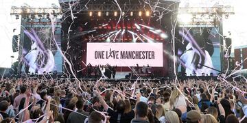 In this photograph released by One Love Manchester on June 4, 2017, music fans gather at the One Love Manchester benefit concert for the families of the victims of the May 22, Manchester terror attack, at Emirates Old Trafford in Greater Manchester on June 4, 2017.  / AFP PHOTO / One Love Manchester / Dave Hogan for One Love Manchester / RESTRICTED TO EDITORIAL USE - MANDATORY CREDIT