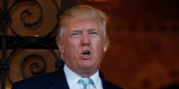 FILE - In this Dec. 28, 2016 file photo, President-elect Donald Trump speaks to reporters at Mar-a-Lago in Palm Beach, Fla. For almost eight years, the members of the Congressional Black Caucus existed in the shadow of the first black president, simultane