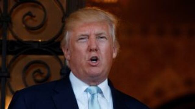 FILE - In this Dec. 28, 2016 file photo, President-elect Donald Trump speaks to reporters at Mar-a-Lago in Palm Beach, Fla. For almost eight years, the members of the Congressional Black Caucus existed in the shadow of the first black president, simultane