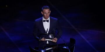 Hungarian player Daniel Zsori receives the FIFA Puskas Award 2019 for the best goal during the ceremony of the Best FIFA Football Awards, in Milan's La Scala theater, northern Italy, Monday, Sept\u002E 23, 2019\u002E \u002E (AP Photo/Antonio Calanni)