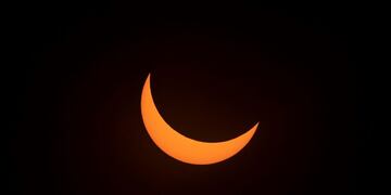 Solar eclipse as seen from the La Silla European Southern Observatory (ESO) in La Higuera, Coquimbo Region, Chile, on July 02, 2019\u002E - Tens of thousands of tourists braced Tuesday for a rare total solar eclipse that was expected to turn day into night along a large swath of Latin America's southern cone, including much of Chile and Argentina\u002E (Photo by Martin BERNETTI / AFP)