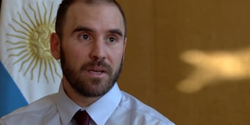 (FILES) In this file photo taken on March 9, 2020 Meric Greenbaum, Designated Market Maker IMC financial looks up at the board before the opening bell right before trading halted on the New York Stock Exchange on in New York\u002E - Wall Street stocks finished another rocky session much lower on March 23, 2020 amid partisan squabbling over a giant stimulus package as the Federal Reserve announced new emergency measures\u002E (Photo by TIMOTHY A\u002E CLARY / AFP)