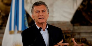Argentine president Mauricio Macri speaks during a press conference at the Casa Rosada presidential building in Buenos Aires on December 19, 2017\u002E\r\nPresident Mauricio Macri's reform, approved on Tuesday's early morning, will play an important part in cutting Argentina's fiscal deficit, with expected savings of 100 billion pesos ($5\u002E6 billion)\u002E / AFP PHOTO / Laureano SALDIVIA buenos aires mauricio macri presidente de la nacion incidentes de manifestantes y la policia disturbios conferencia de prensa
