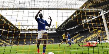 Soccer Football - Bundesliga - Borussia Dortmund v Schalke 04 - Signal Iduna Park, Dortmund, Germany - May 16, 2020 Schalke's Salif Sane reacts in the goal after Dortmund's Raphael Guerreiro scored his side's second goal against Schalke's goalkeeper Markus Schubert, right, as play resumes behind closed doors following the outbreak of the coronavirus disease (COVID-19) Martin Meissner/Pool via REUTERS  DFL regulations prohibit any use of photographs as image sequences and/or quasi-video