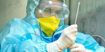 A health worker holds a swab sample to put it into a test tube at a COVID-19 coronavirus testing centre in Srinagar on July 16, 2020\u002E (Photo by TAUSEEF MUSTAFA / AFP)