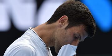 TOPSHOT - Serbia's Novak Djokovic reacts after a point against Uzbekistan's Denis Istomin during their men's singles match on day four of the Australian Open tennis tournament in Melbourne on January 19, 2017. / AFP PHOTO / PAUL CROCK / IMAGE RESTRICTED T