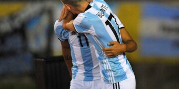 Argentina`s player Brian Ezequiel Mansilla (L) celebrates with Tomas Belmonte a goal against Brazil during their U-20 South American Championship football match in the Olimpico Atahualpa stadium in Quito, Ecuador on February 08, 2017. / AFP PHOTO / JUAN