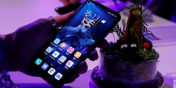 FILE - In this Tuesday, May 21, 2019 file photo, a member of the media tries out new Huawei Honor 20 series of phones following their global launch in London\u002E Facebook has stopped letting its apps come pre-installed on smartphones sold by Huawei to comply with U\u002ES\u002E restrictions, dealing a fresh blow to the Chinese tech giant\u002E The social network said Friday, June 7 it suspended providing software for Huawei to put on its devices while it reviews recently introduced U\u002ES\u002E sanctions\u002E (AP Photo/Alastair Grant, file)