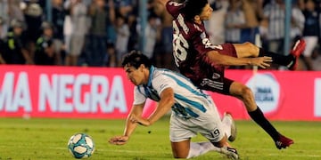 Nicolas Diego Aguirre of Atletico Tucuman vies for the ball with Ignacio Fernandez of River Plate, during their Superliga football match, at the Jose Fierro stadium in Tucuman, Argentina on March 7, 2020\u002E (Photo by Walter Monteros / AFP)
