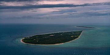2ad634b7-ff3c-4a21-b287-ebc4b739421c|As climate change pushes the tides higher, Masig Island, like all of the Torres Strait Islands, is at risk of vanishing\u002E (Matthew Abbott for The New York Times)