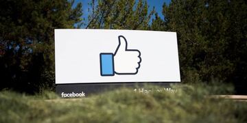 (FILES) This file photo taken on November 4, 2016 shows the Facebook sign and logo in Menlo Park, California. nFacebook said on May 3, 2017, it would add 3,000 people to screen out violent content as the social media giant faces scrutiny for a series of killings and suicides broadcast on its platform.