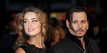 FILE - In this Oct\u002E 11, 2015 file photo, Amber Heard, left, and Johnny Depp arrive at the premiere of Depp's film \