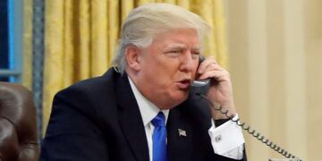 FILE - In this Jan. 28, 2017, file photo, President Donald Trump speaks on the phone with Prime Minister of Australia Malcolm Turnbull in the Oval Office of the White House in Washington. Trump, who blasted Hillary Clinton for using a personal email server, might be a walking magnet for eavesdropping and malware if he is using an unsecured cellphone to chat with foreign leaders. Trump has been handing out his cellphone number to counterparts around the world, urging them to call him directly to avoid the red tape of diplomatic communications. The practice has raised concern about the security and secrecy of the U.S. commander-in-chief's communications. (AP Photo/Alex Brandon, File)