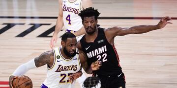 LAKE BUENA VISTA, FLORIDA - OCTOBER 04: LeBron James #23 of the Los Angeles Lakers drives to the basket against Jimmy Butler #22 of the Miami Heat during the first half in Game Three of the 2020 NBA Finals at AdventHealth Arena at ESPN Wide World Of Sports Complex on October 04, 2020 in Lake Buena Vista, Florida\u002E NOTE TO USER: User expressly acknowledges and agrees that, by downloading and or using this photograph, User is consenting to the terms and conditions of the Getty Images License Agreement\u002E Douglas P\u002E DeFelice/Getty Images/AFP\n== FOR NEWSPAPERS, INTERNET, TELCOS & TELEVISION USE ONLY ==