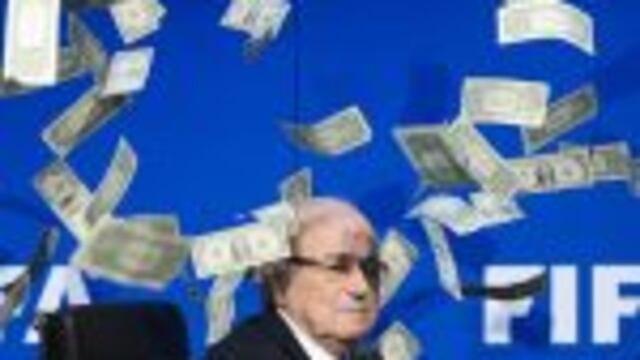 (FILES) This file photo taken on July 20, 2015 at the FIFA world-body headquarter's in Zurich shows FIFA president Sepp Blatter looking on as fake dollar notes fly around him, thrown by a British comedian during a press conference. nThe Court of Arbitrati